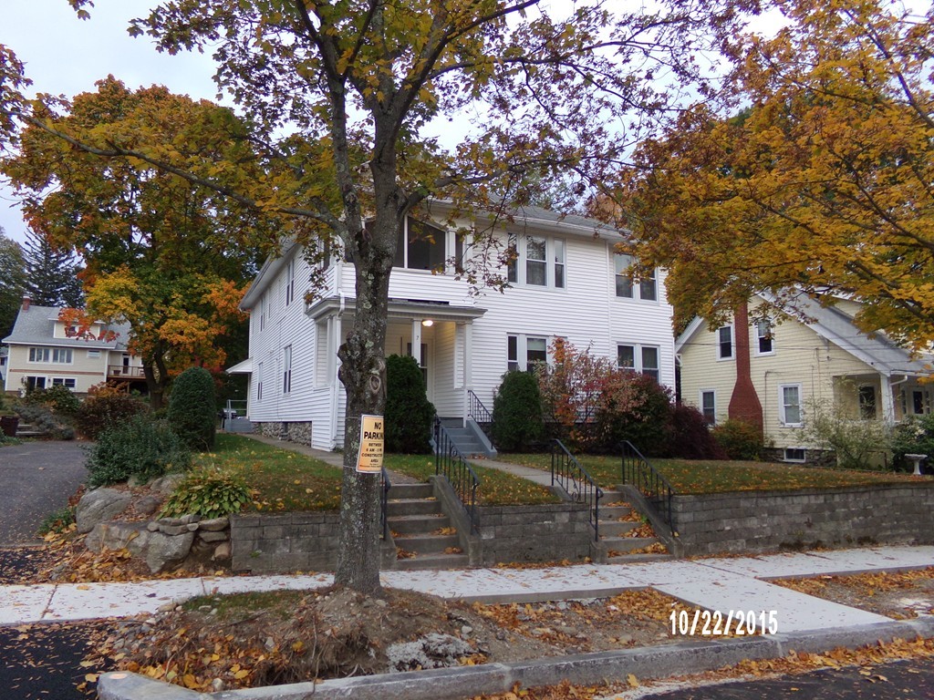 7 Dellwood Road Worcester, MA 01602 - Photo 2 of 19 a front view of a house with a yard