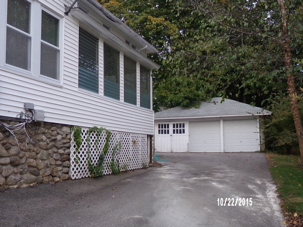 7 Dellwood Road Worcester, MA 01602 - Photo 4 of 19 a front view of a house with a garage
