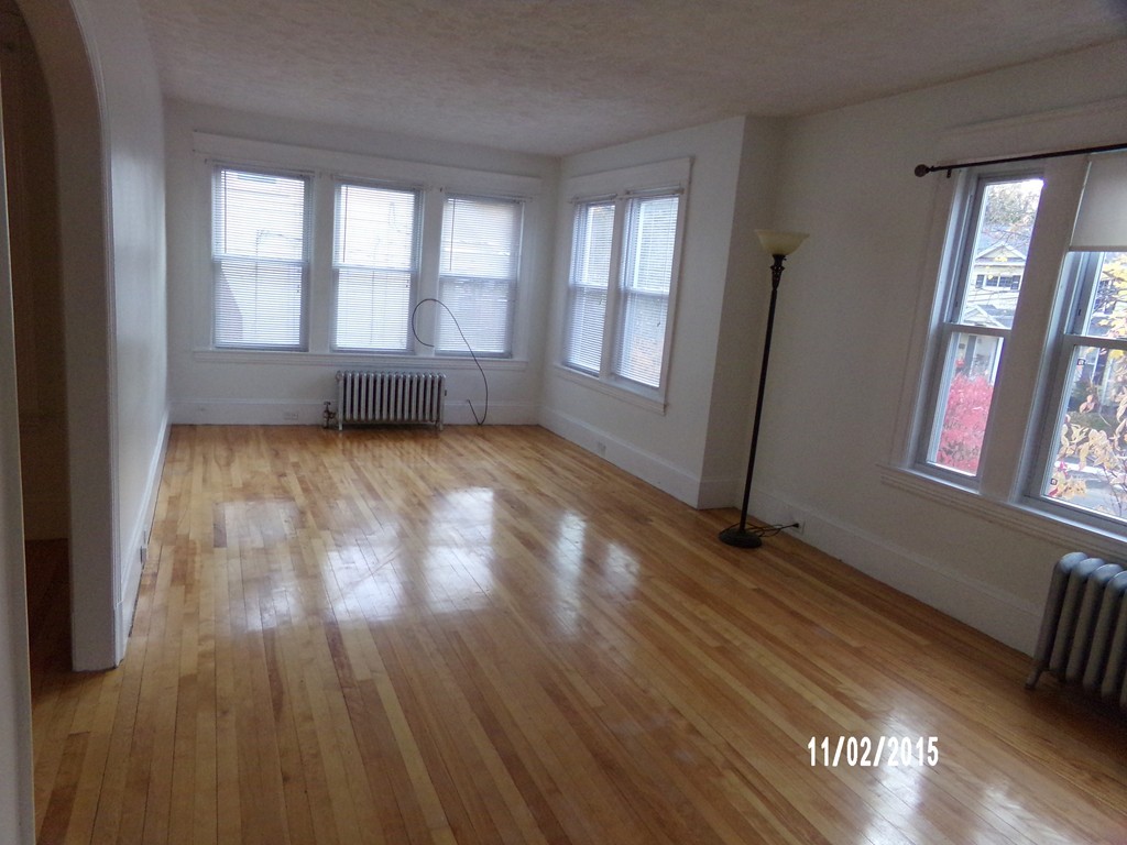 7 Dellwood Road Worcester, MA 01602 - Photo 8 of 19 a view of an empty room with wooden floor and a window