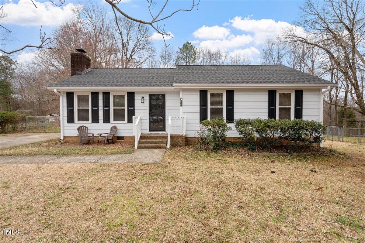 5144 Shield Circle Raleigh, NC 27603 - Photo 1 of 41 a front view of a house with garden