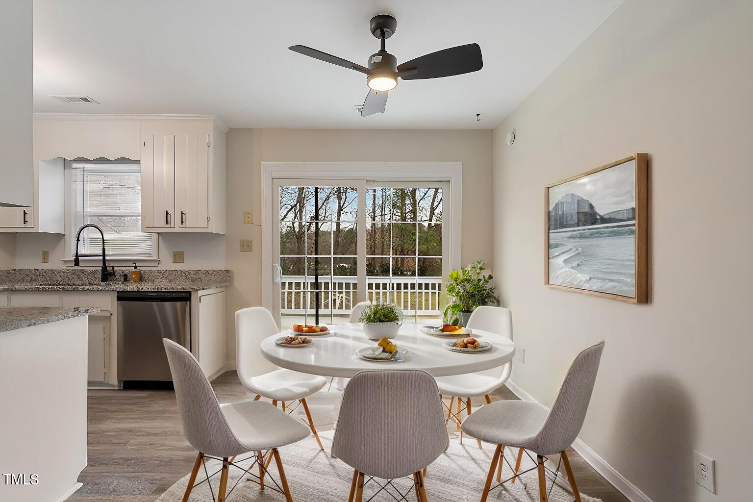 5144 Shield Circle Raleigh, NC 27603 - Photo 11 of 41 a kitchen with a table chairs and a sink
