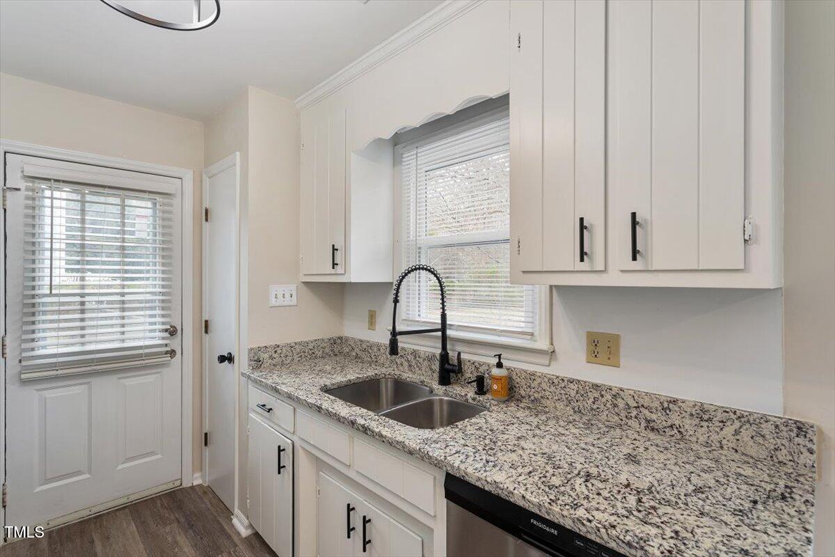 5144 Shield Circle Raleigh, NC 27603 - Photo 15 of 41 a kitchen with granite countertop white cabinets and a sink