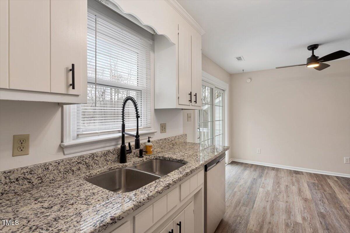 5144 Shield Circle Raleigh, NC 27603 - Photo 18 of 41 a kitchen with a sink cabinets and window