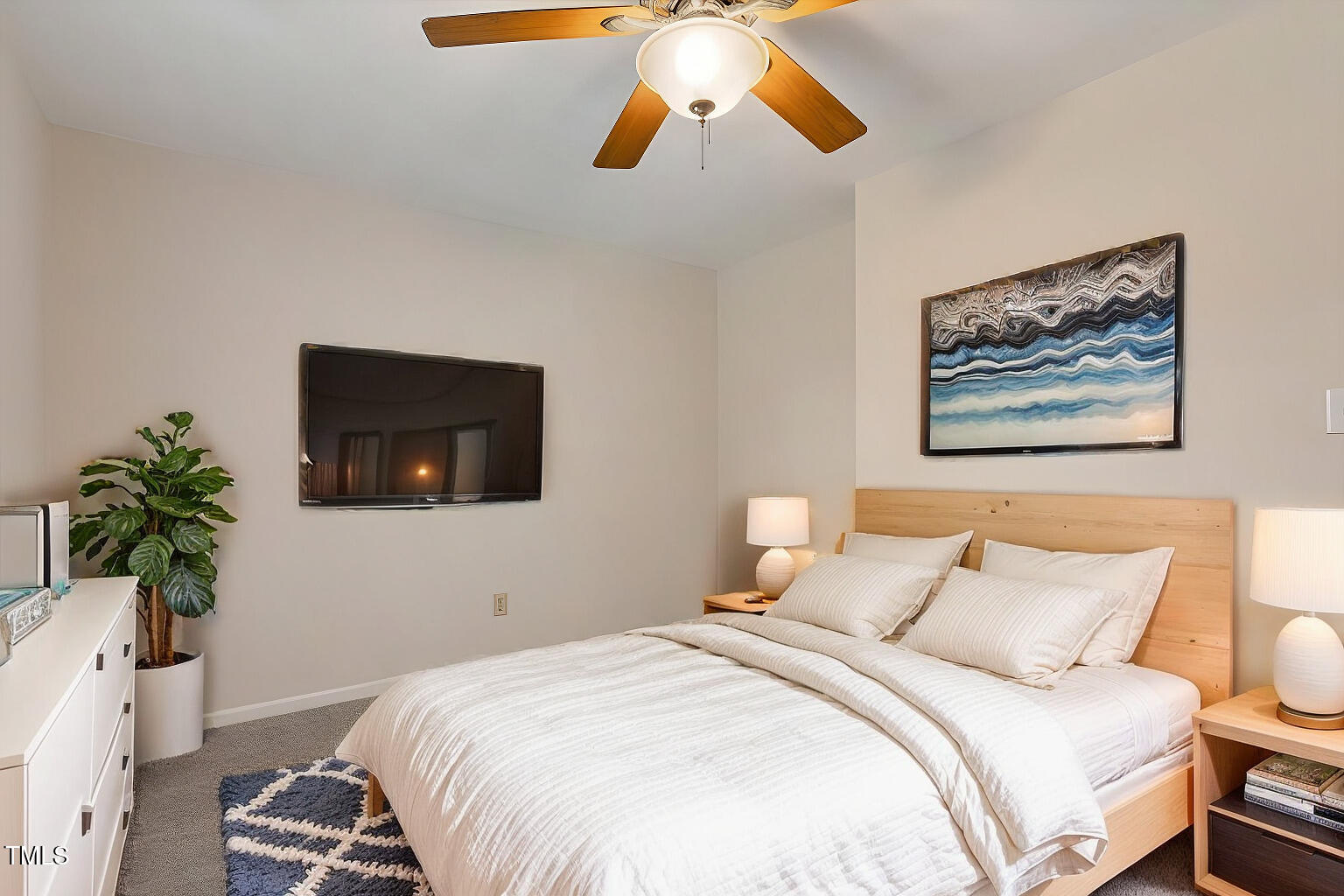 5144 Shield Circle Raleigh, NC 27603 - Photo 19 of 41 a bedroom with a bed and a chandelier