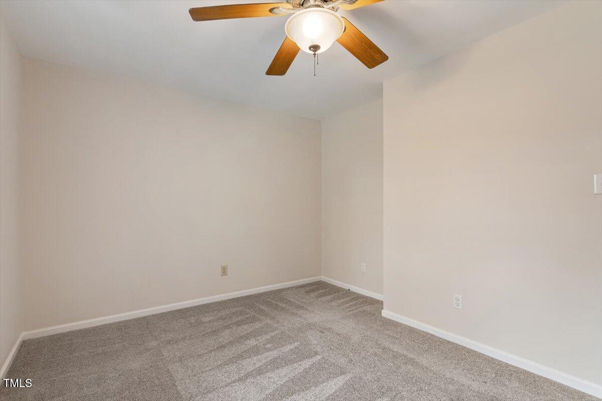 5144 Shield Circle Raleigh, NC 27603 - Photo 20 of 41 a view of room with a ceiling fan and window