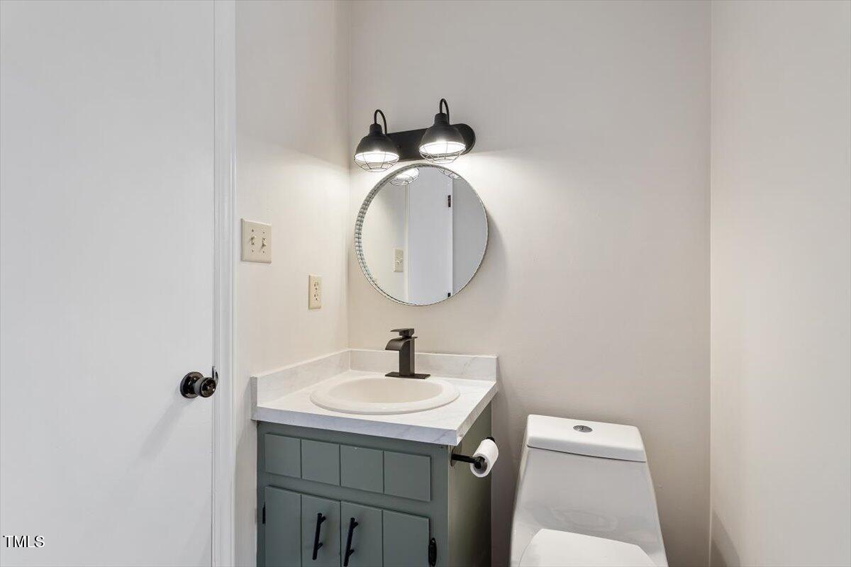5144 Shield Circle Raleigh, NC 27603 - Photo 24 of 41 a bathroom with a sink and a mirror