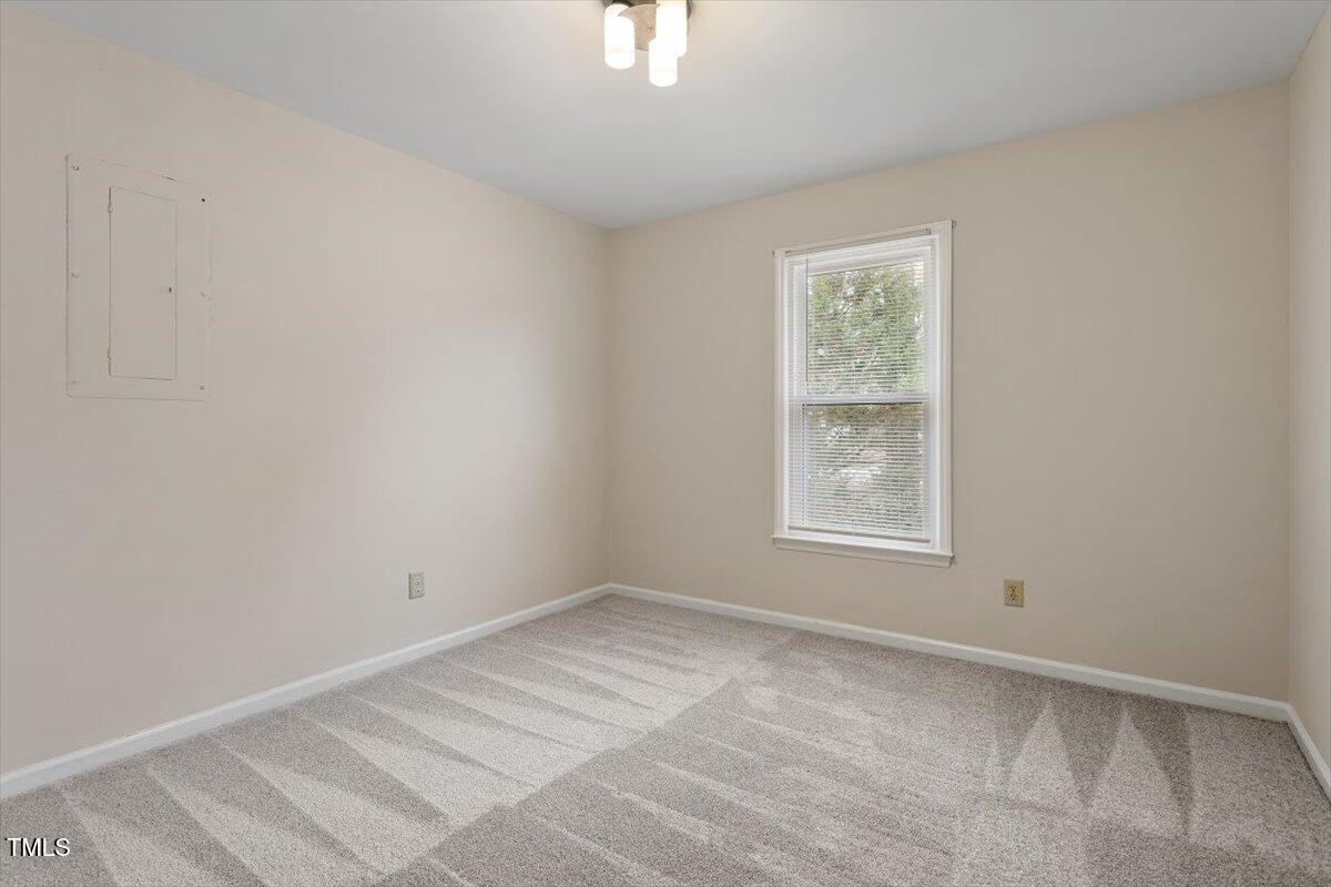 5144 Shield Circle Raleigh, NC 27603 - Photo 26 of 41 a view of an empty room with a window