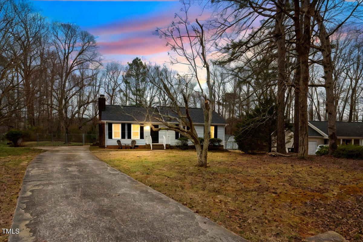 5144 Shield Circle Raleigh, NC 27603 - Photo 3 of 41 a tall house with trees in front of it