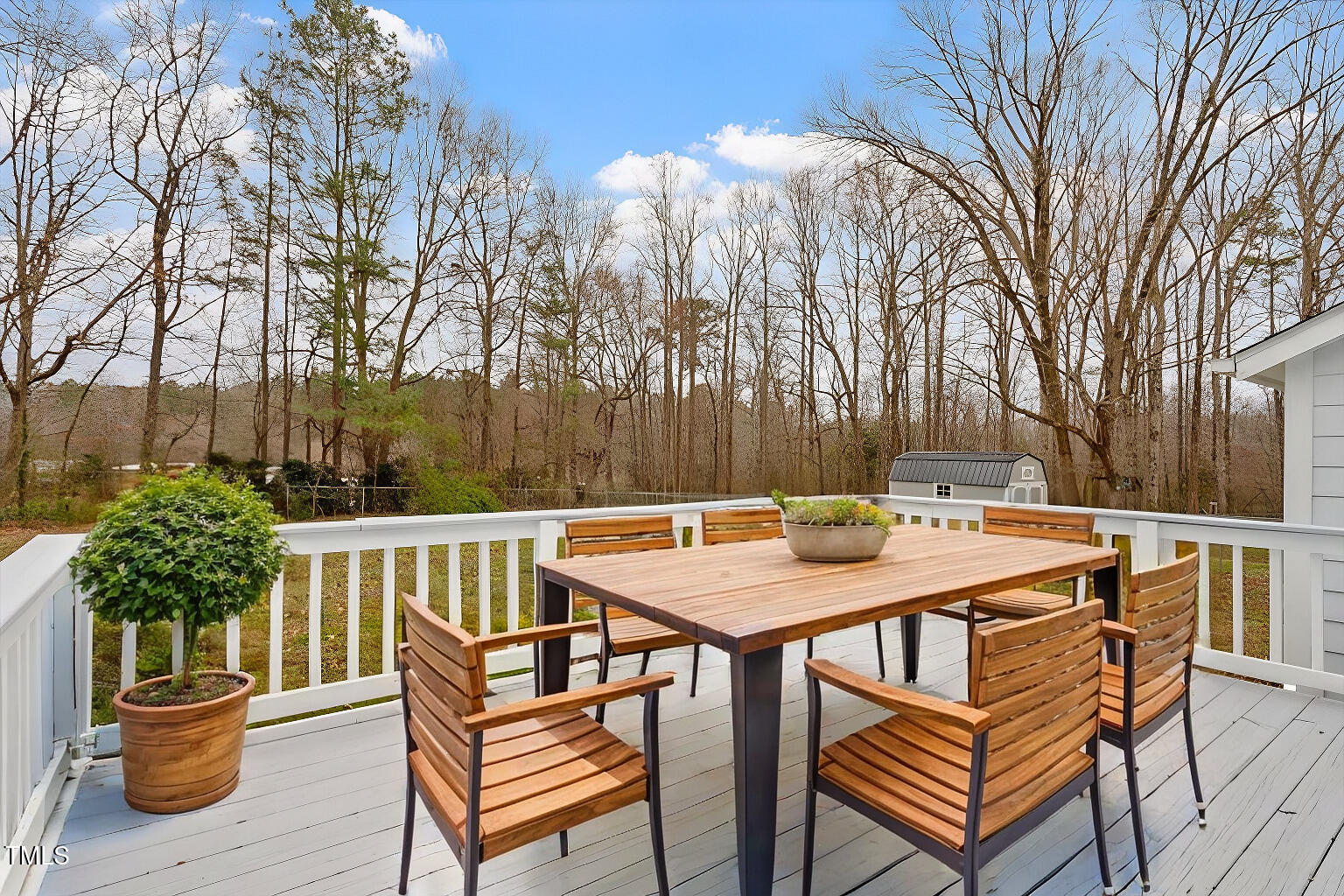 5144 Shield Circle Raleigh, NC 27603 - Photo 32 of 41 a view of a patio with a table and chairs