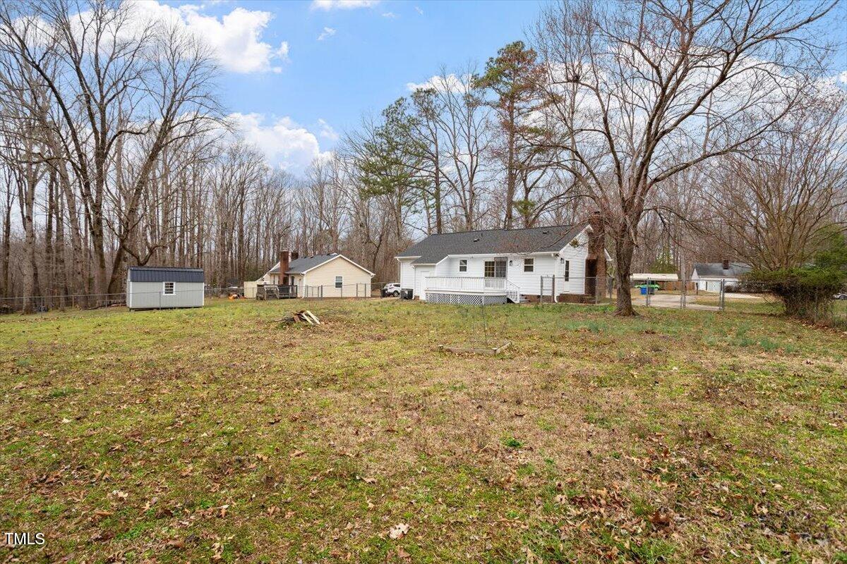5144 Shield Circle Raleigh, NC 27603 - Photo 35 of 41 a house with trees in front of it