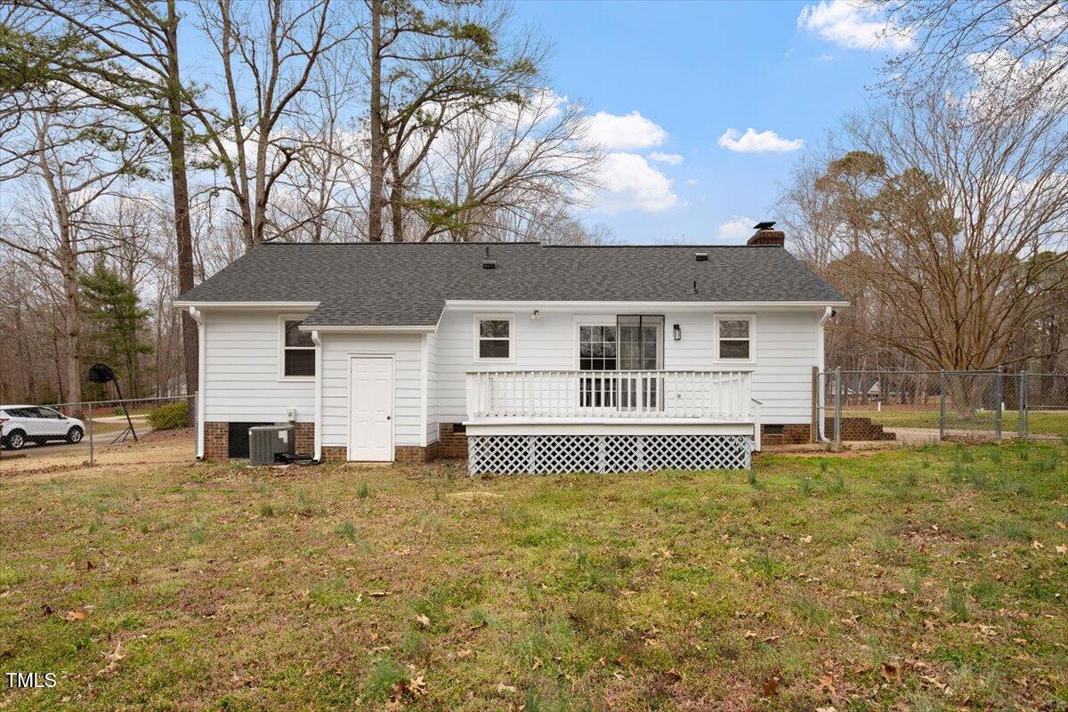 5144 Shield Circle Raleigh, NC 27603 - Photo 38 of 41 front view of a house with a big yard and large tree
