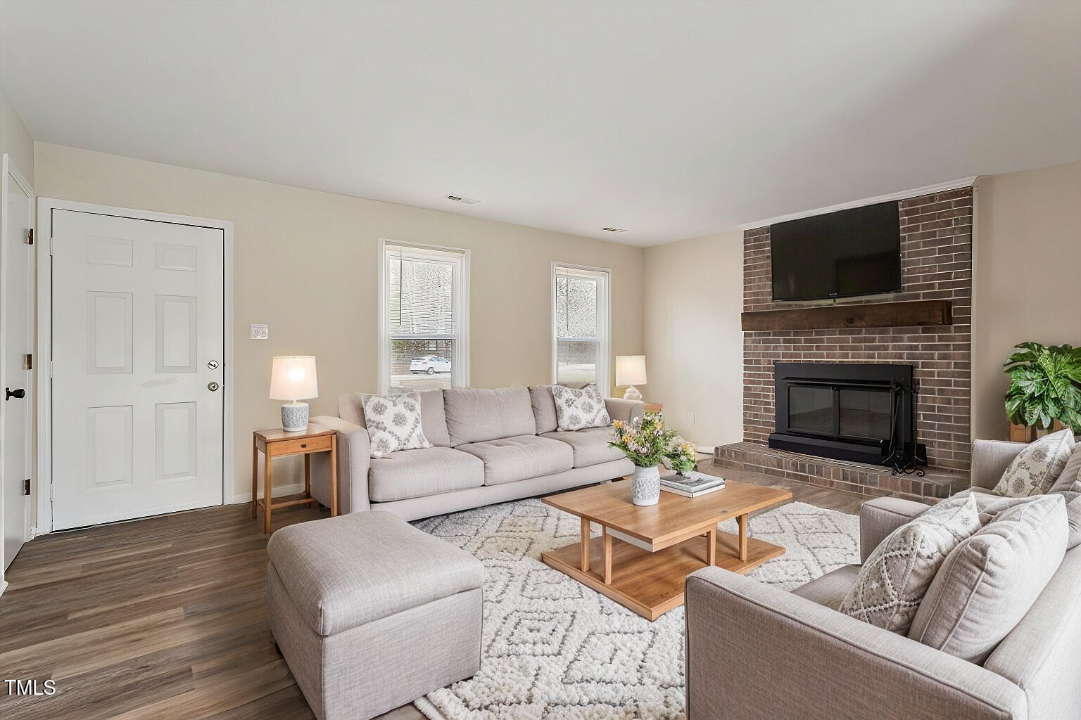 5144 Shield Circle Raleigh, NC 27603 - Photo 4 of 41 a living room with furniture and a fireplace