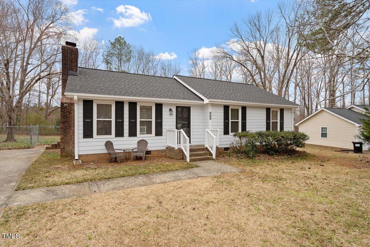5144 Shield Circle Raleigh, NC 27603 - Photo 41 of 41 a front view of a house with a yard outdoor seating and barbeque oven