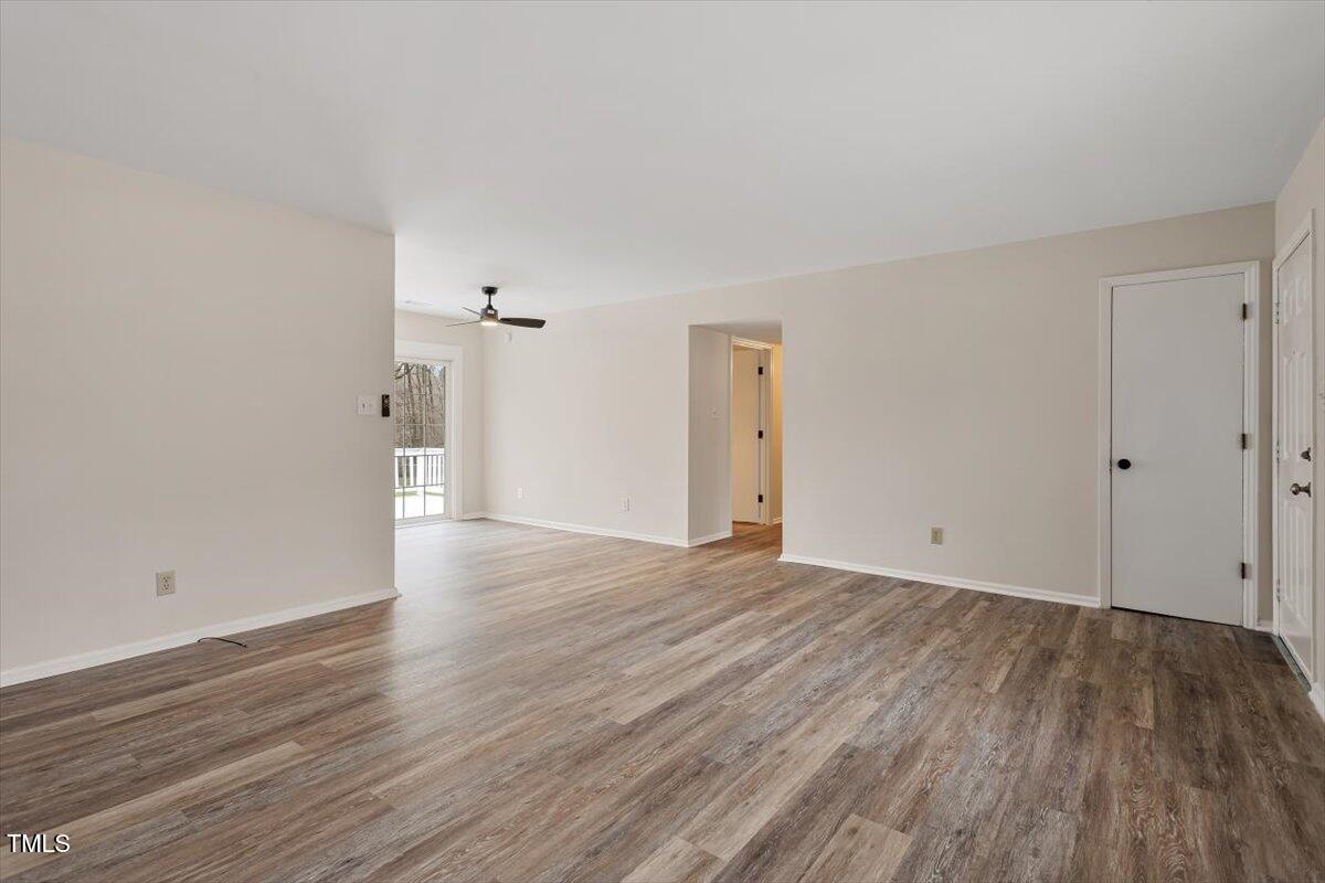 5144 Shield Circle Raleigh, NC 27603 - Photo 10 of 41 a view of an empty room and wooden floor