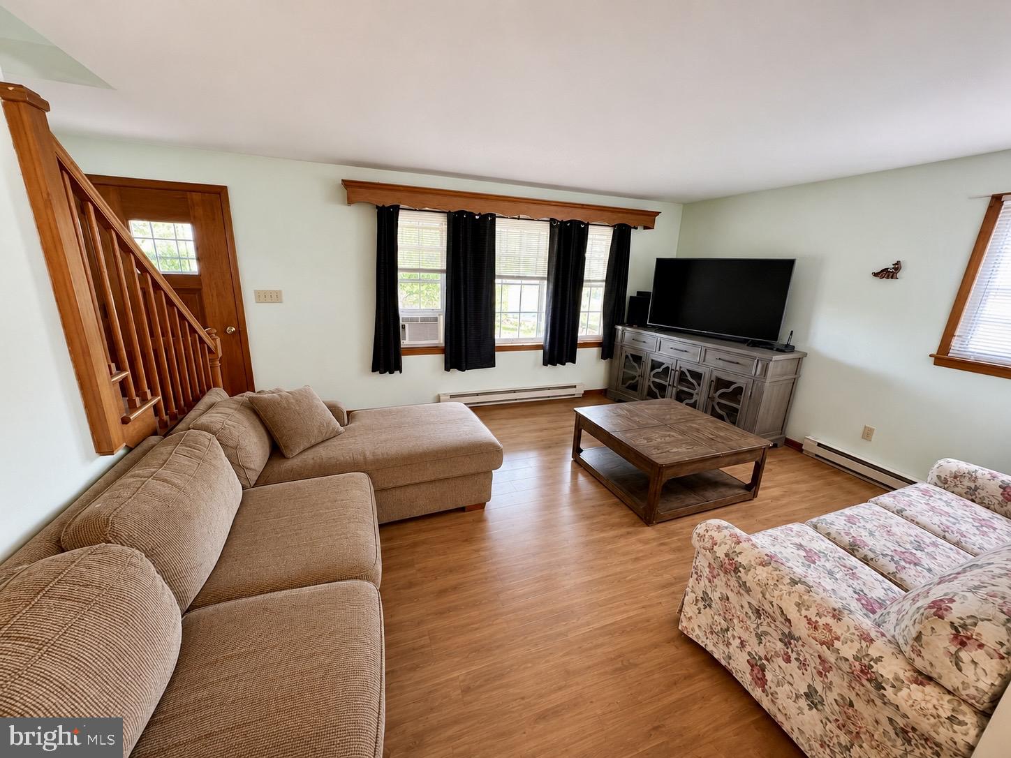 487 Prospect Road Manheim, PA 17545 - Photo 6 of 24 a living room with furniture a flat screen tv and a large window