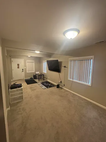 a kitchen with a refrigerator and a sink