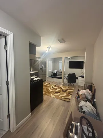 a bathroom with a granite countertop sink toilet a mirror and a sink
