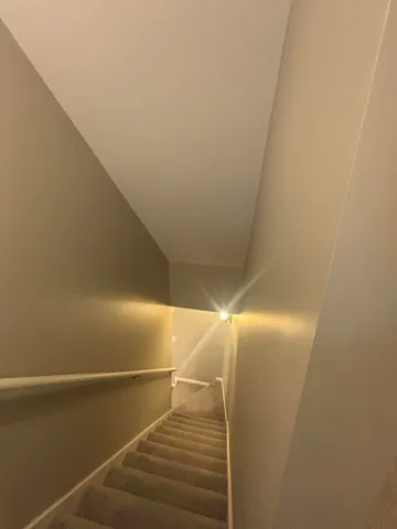 a bathroom with a sink a mirror and shower