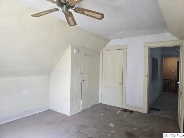 a room with a cabinets and window