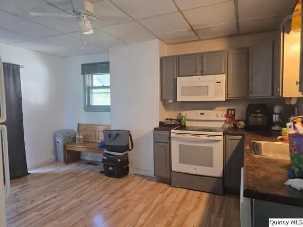 a kitchen with a stove and a refrigerator
