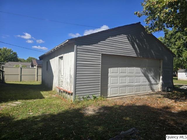 445 Wilcox Street Warsaw, IL 62379 - Photo 22 of 29 a front view of a house with garden
