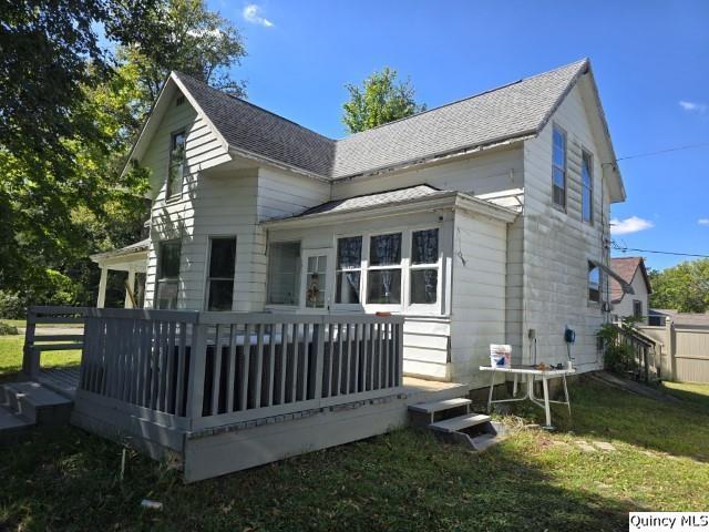 445 Wilcox Street Warsaw, IL 62379 - Photo 23 of 29 a view of a house with a yard