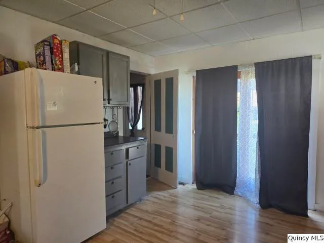 a kitchen with stainless steel appliances granite countertop a refrigerator and a stove