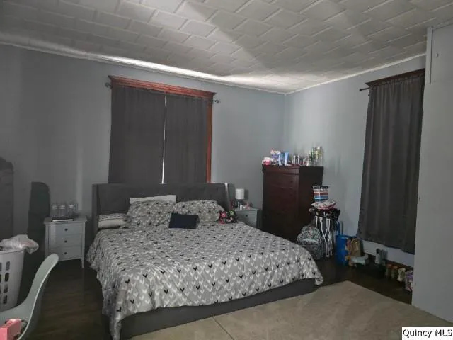 a bedroom with a bed and furniture