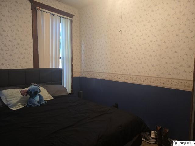 445 Wilcox Street Warsaw, IL 62379 - Photo 9 of 29 a room with wooden floor and a window