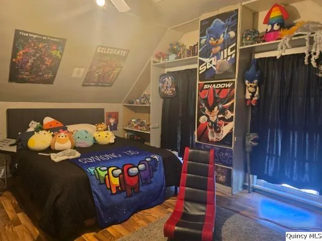 a bedroom with furniture and a window