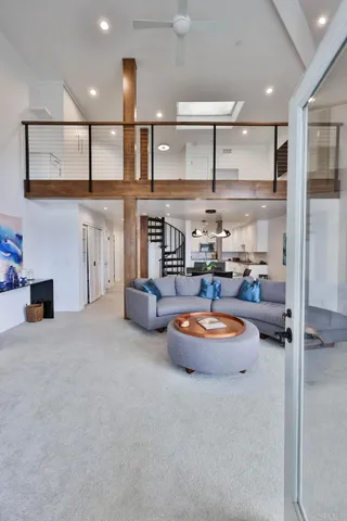 a kitchen with stainless steel appliances granite countertop a sink and a refrigerator