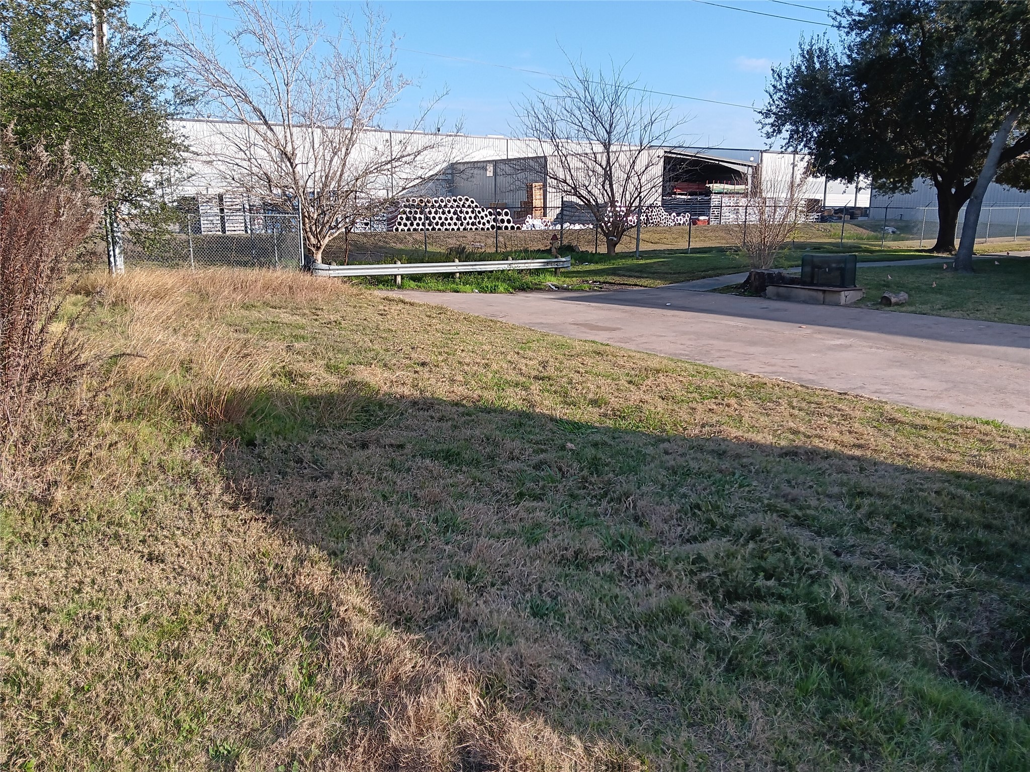 0 Bennett Drive Pasadena, TX 77503 - Photo 1 of 3 a view of road with large trees