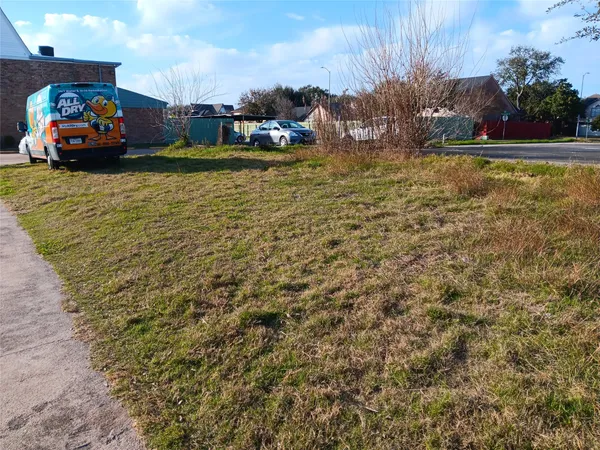 a swimming pool with some trees in the background