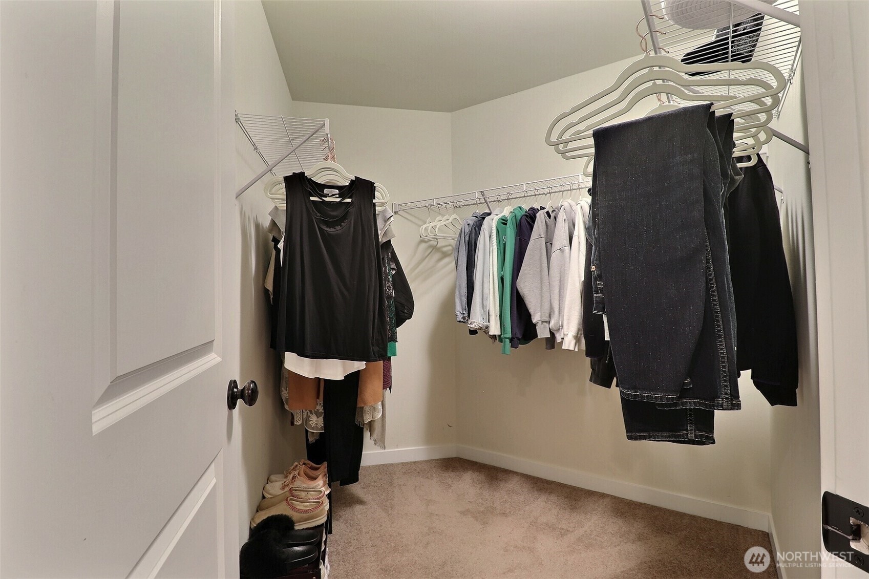19776 Mountain Ridge Road Southeast Monroe, WA 98272 - Photo 24 of 40 a view of walk in closet with clothes and shoes