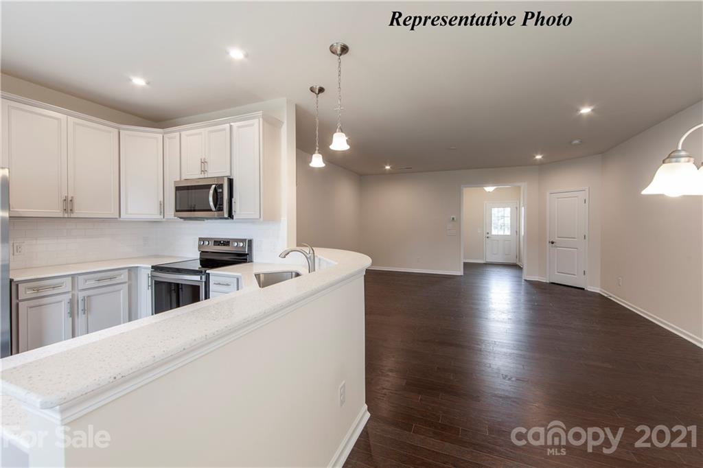 469 Hunters Dance Road, Unit 339 Fort Mill, SC 29708 - Photo 7 of 19 a kitchen with stainless steel appliances a refrigerator sink and microwave