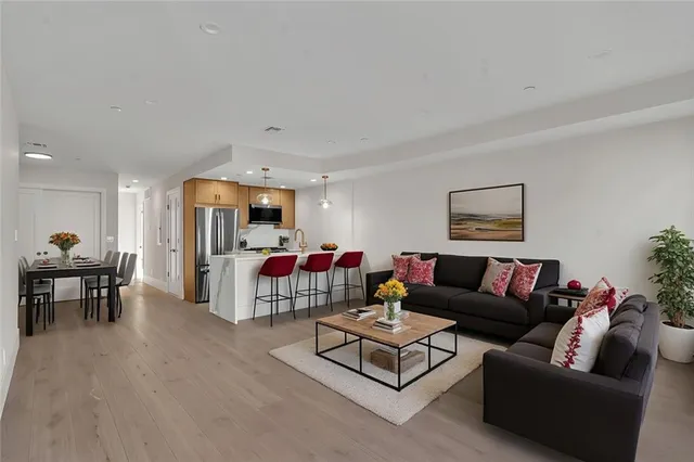 a living room with furniture and a table