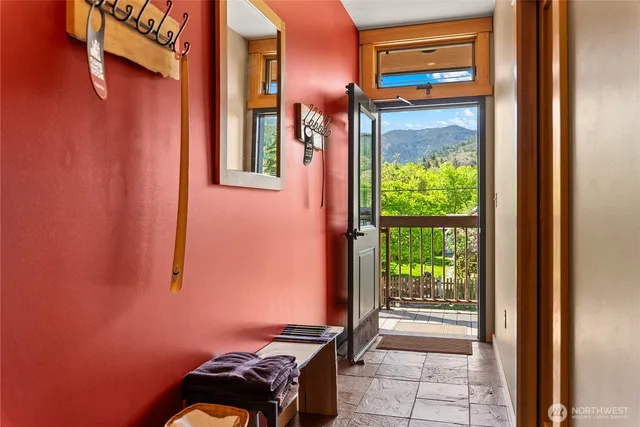 a spacious bedroom with a bed and a chandelier