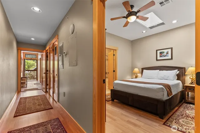 a bed sitting in a bedroom next to a window