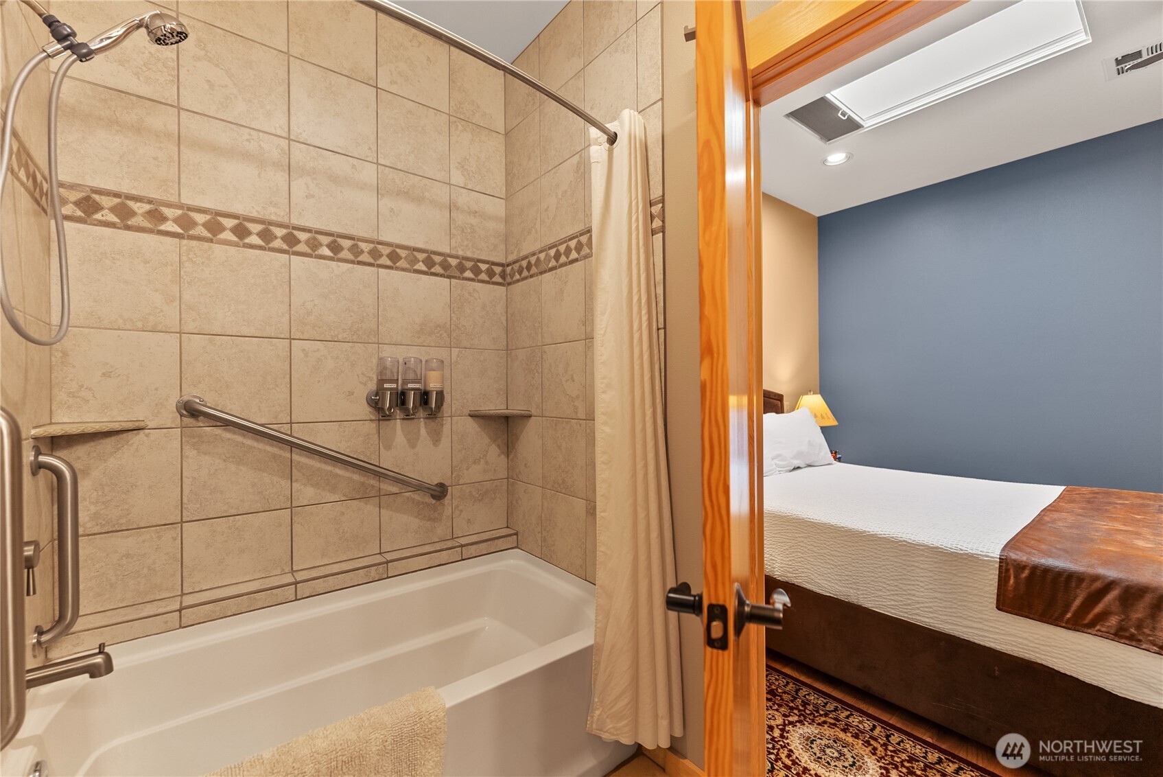 140 Twisp Avenue, Unit 204 Twisp, WA 98856 - Photo 17 of 40 a bathroom with a bathtub and shower
