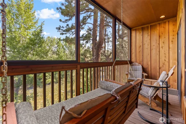 a living room with furniture and a rug