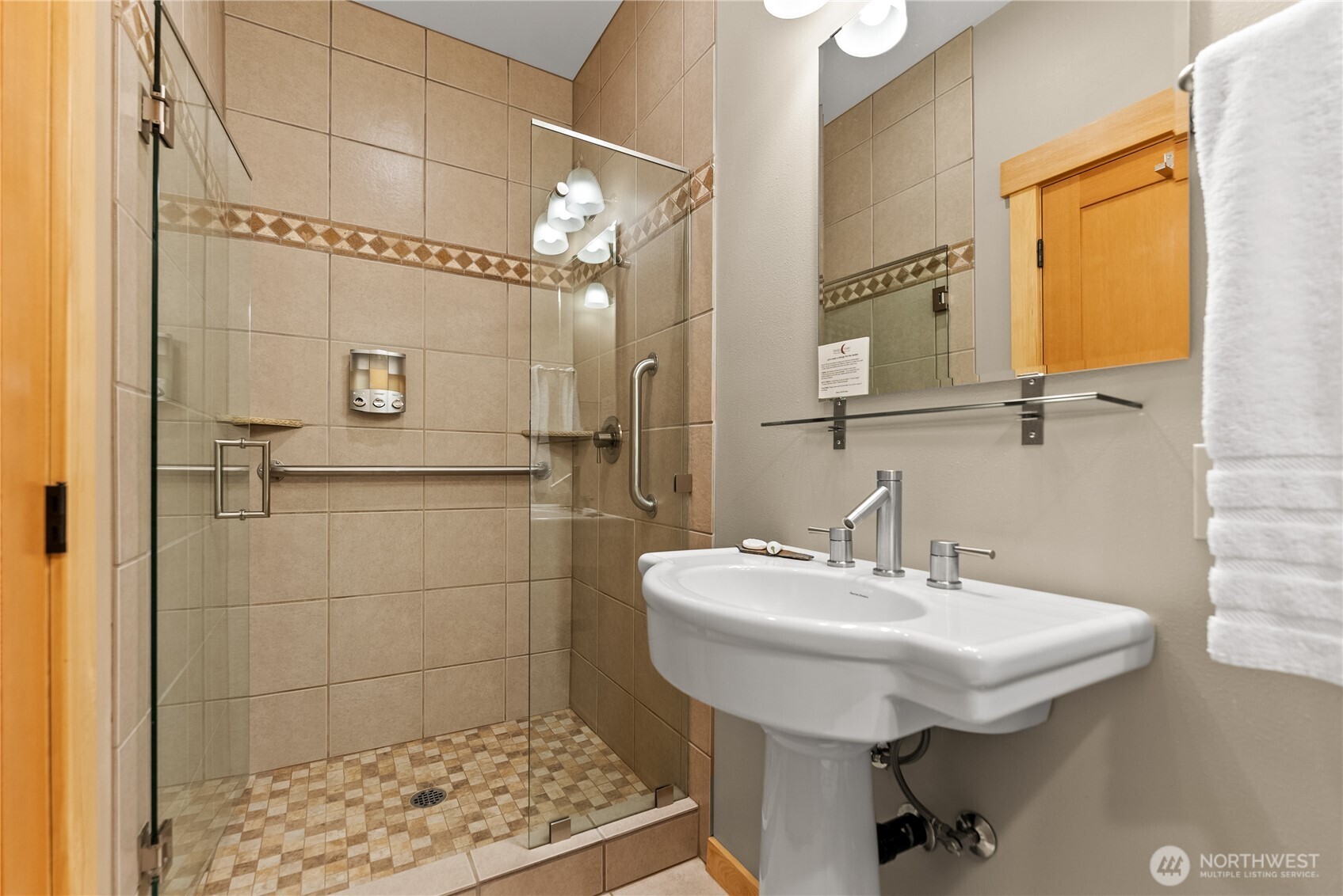 140 Twisp Avenue, Unit 204 Twisp, WA 98856 - Photo 31 of 40 a bathroom with a sink a toilet and shower
