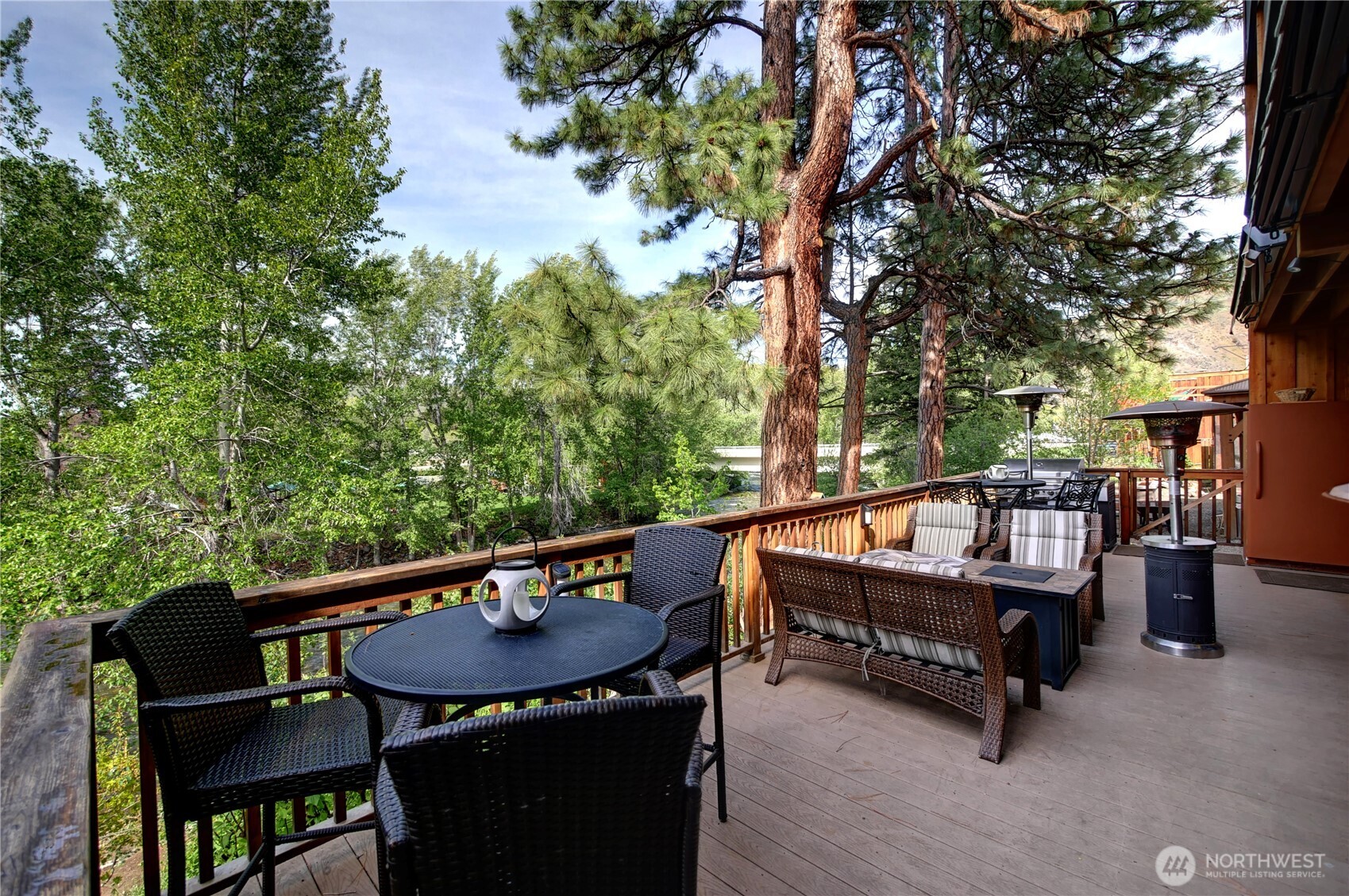140 Twisp Avenue, Unit 204 Twisp, WA 98856 - Photo 8 of 40 a view of a balcony with chairs