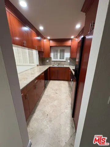 a view of kitchen with cabinets and wooden floor