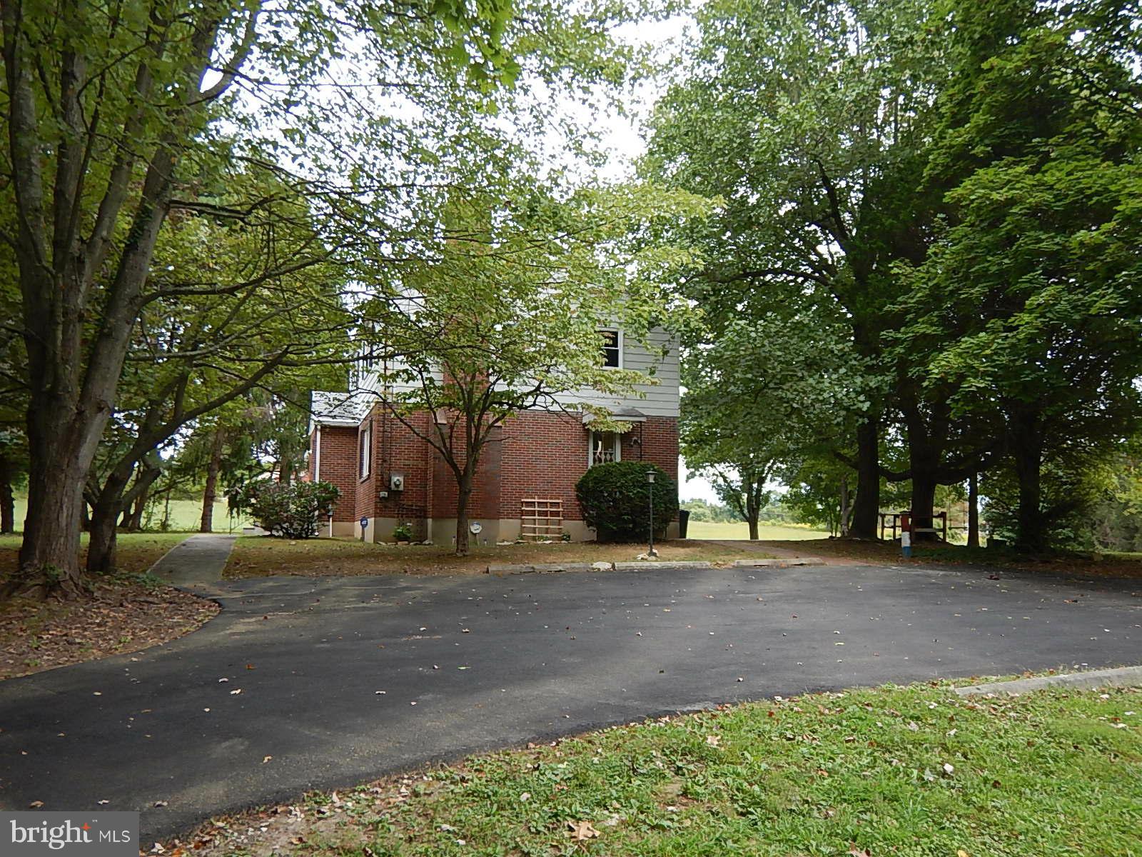 Parking Pad and Right Side of Home
