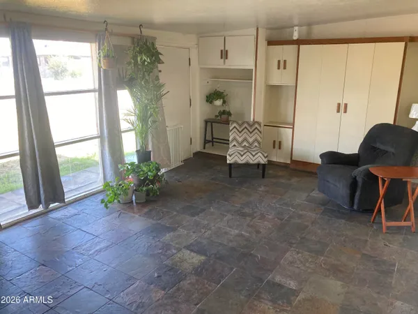 a living room with furniture and a large window
