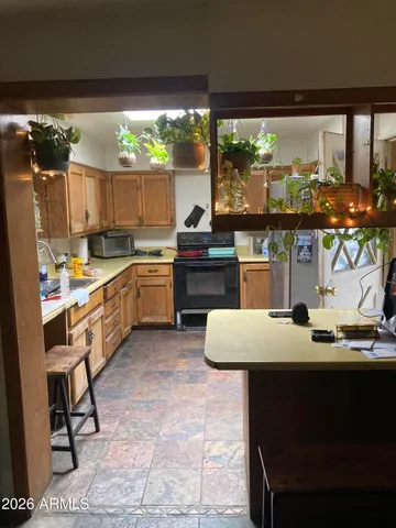 a kitchen with a table chairs and a stove