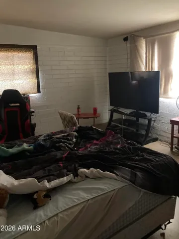 a room with furniture and flat screen tv