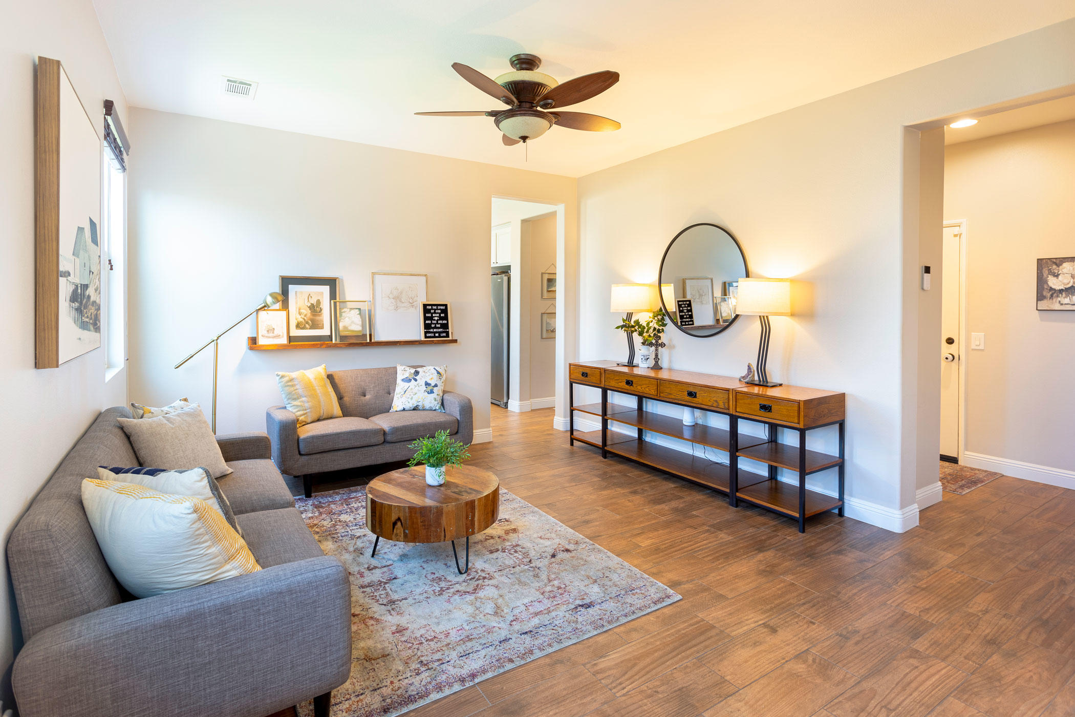 37196 Sandwell Street Indio, CA 92203 - Photo 11 of 34 a living room with furniture and a large window