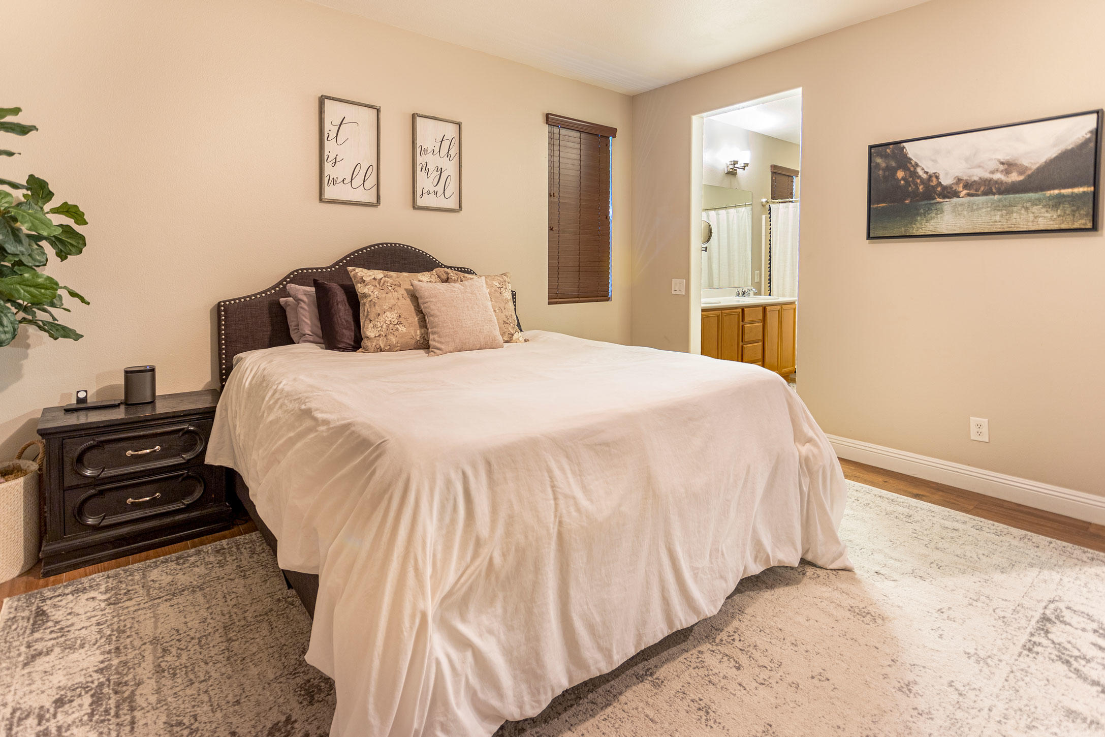 37196 Sandwell Street Indio, CA 92203 - Photo 14 of 34 a bedroom with a bed and a painting on the wall