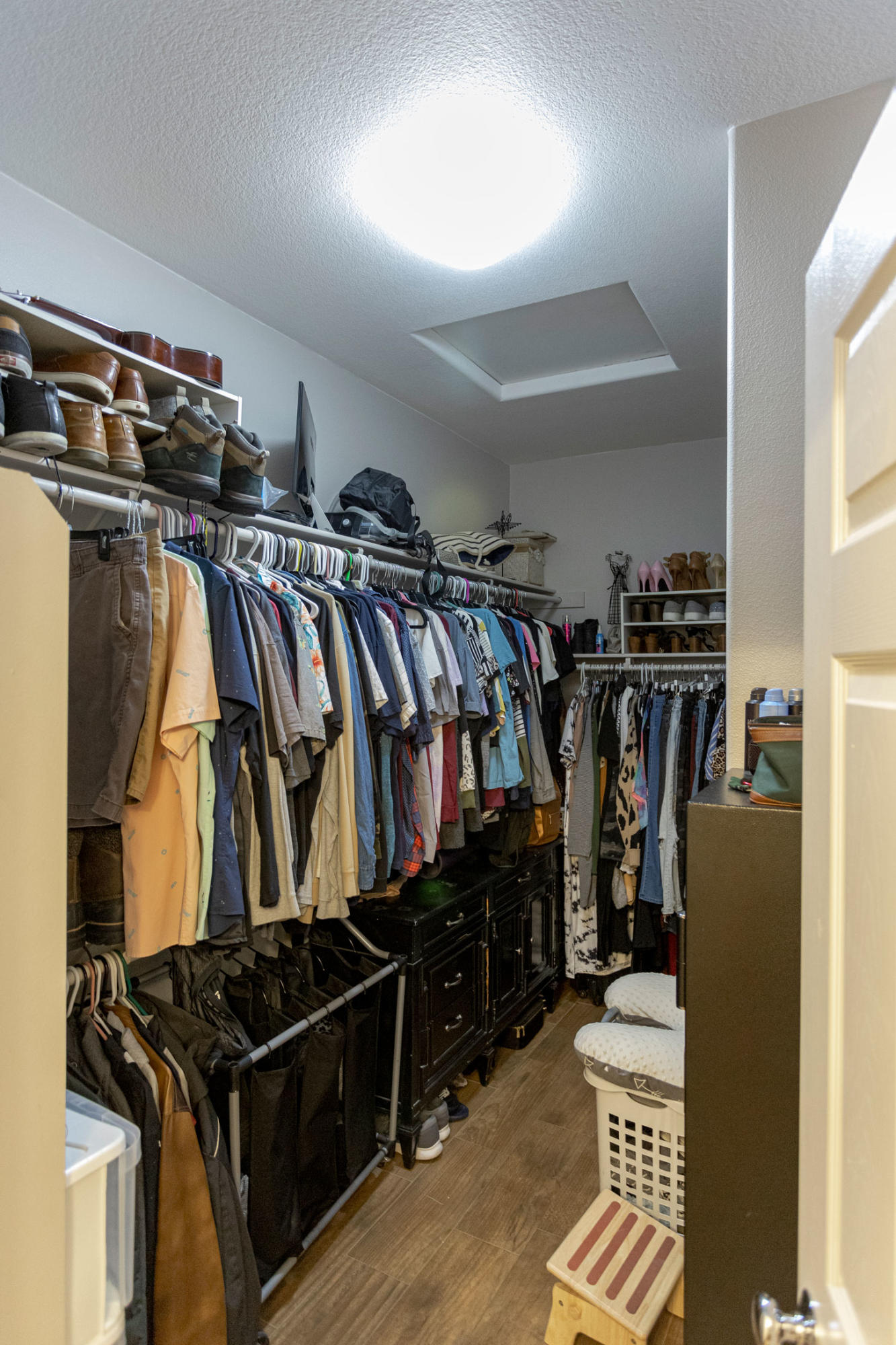 37196 Sandwell Street Indio, CA 92203 - Photo 18 of 34 a view of walk in closet with clothes and shoes